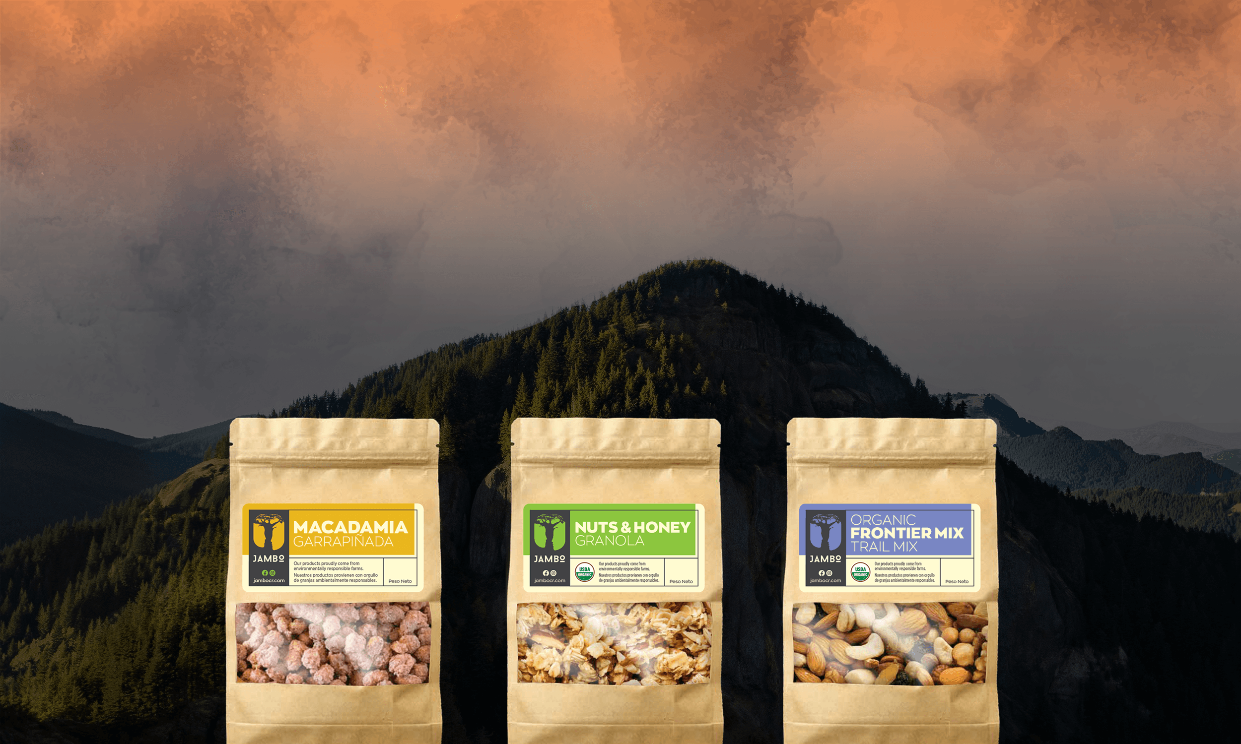 Jambo pouches of macadamia, granola and trail mix in front of a mountain sunset